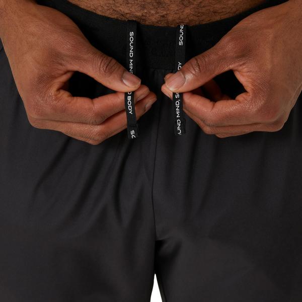 Asics Pantalon Road Pant PERFORMANCE BLACK Tifoshop